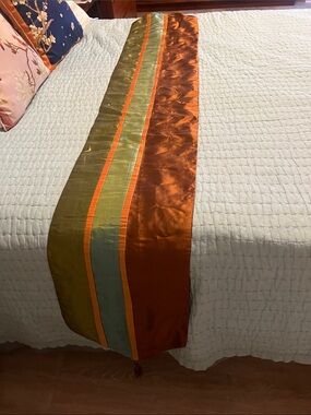 stunning Silk-Look Orange and Olive Table Runner  with tassel ends. 74”